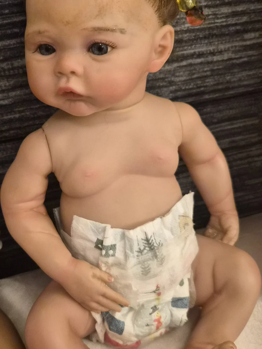 Reborn Baby Doll with Brown Hair and Pink Hair Beads
